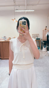 Knit vest w/ string details collar