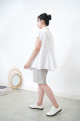 White shirt w/ peplum hem details