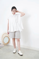 White shirt w/ peplum hem details