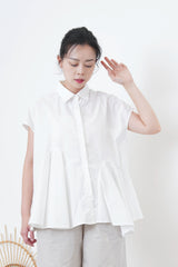 White shirt w/ peplum hem details