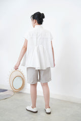 White shirt w/ peplum hem details