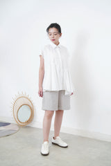 White shirt w/ peplum hem details