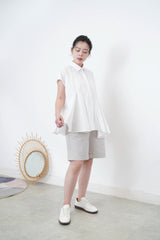 White shirt w/ peplum hem details