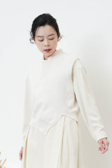 Ivory asy. Vest in fringe trimming