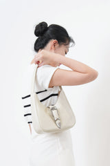 Ivory leather shoulder bag w/ belt details
