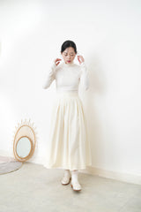 Ivory knit vest w/ side ribbons