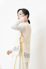Ivory knit vest w/ side ribbons