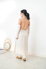 Ivory in a cut skirt with waist strap