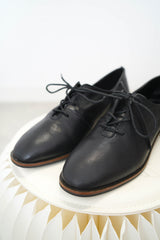 Black leather lace up shoes