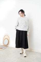 Grey sweater in crochet net details