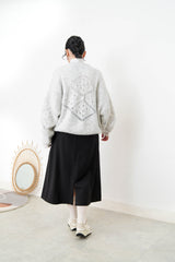 Grey sweater in crochet net details
