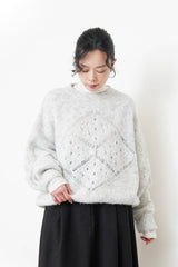 Grey sweater in crochet net details