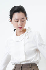 Ivory knit vest in side split ribbons