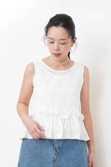 White dotted pattern vest w/ peplum hem