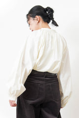 White shirt in detail pleats