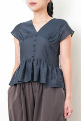 Navy V neck blouse in peplum hem