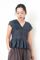 Navy V neck blouse in peplum hem