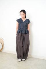 Navy V neck blouse in peplum hem