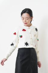 White cardigan w/ Christmas elements