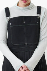 Black worker pleats skirt w/ red outline stitches