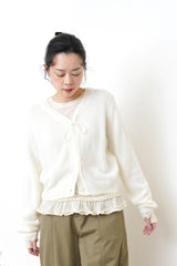 Ivory thin top w/ peplum hem