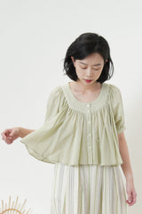 Ruffle blouse in crop cut