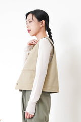 Beige pocket vest in worker style