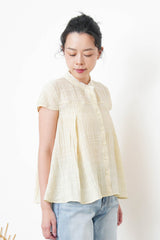Yellow blouse in lace round neck