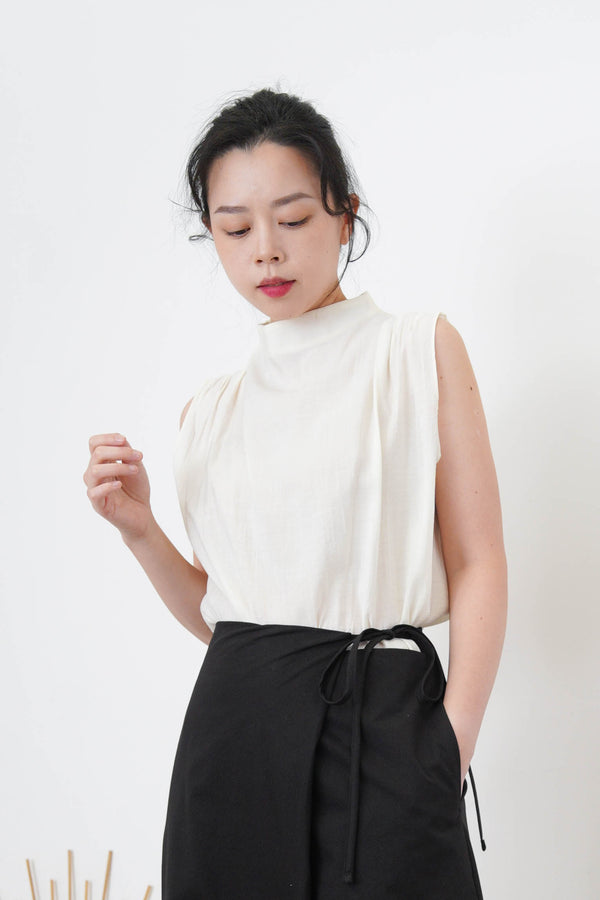 Ivory high neck blouse in pleats shoulders