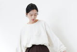 White cross cutting top in elastic hem