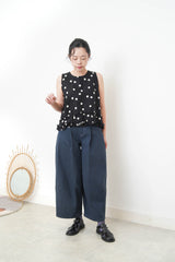 Navy dotted vest w/ ruffles hem
