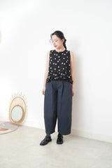 Navy dotted vest w/ ruffles hem