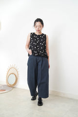 Navy dotted vest w/ ruffles hem