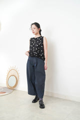 Navy dotted vest w/ ruffles hem