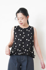 Navy dotted vest w/ ruffles hem