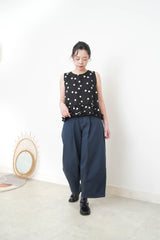 Navy dotted vest w/ ruffles hem