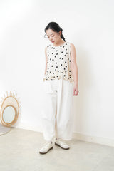 Ivory dotted vest w/ ruffles hem