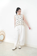 Ivory dotted vest w/ ruffles hem