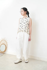 Ivory dotted vest w/ ruffles hem