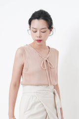 Knit vest w/ string details collar