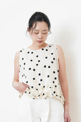 Ivory dotted vest w/ ruffles hem