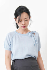 Blue knit top w/ ribbon collar details