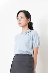 Blue knit top w/ ribbon collar details