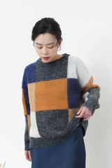Orange mixed square pattern sweater