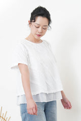 White double layering flare blouse in ruffles details