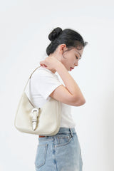 Ivory leather shoulder bag w/ belt details