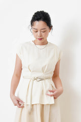 Cream split hem vest w/ gather waist details