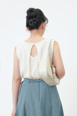 Ivory knit vest in pleats open back