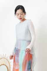 Pink sheer vest in asymmetrical cut