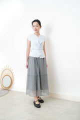 Baby blue vest in overlaping waist details